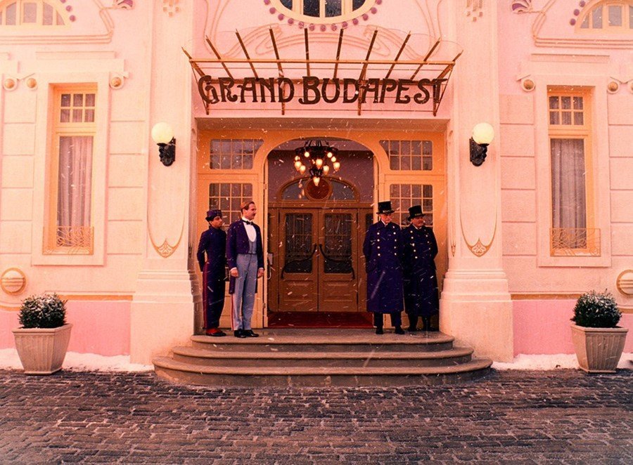 The Grand Budapest Hotel (2014) – ornate pastel hotel lobby set construction showcasing Wes Anderson film set design