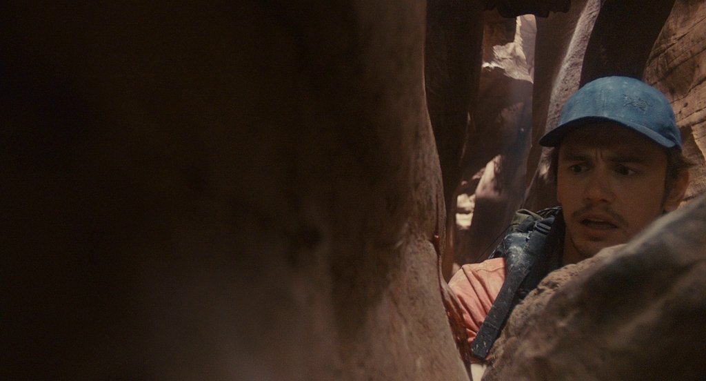 Film still from 127 Hours (2010) showing James Franco's character trapped in a canyon by British director Danny Boyle