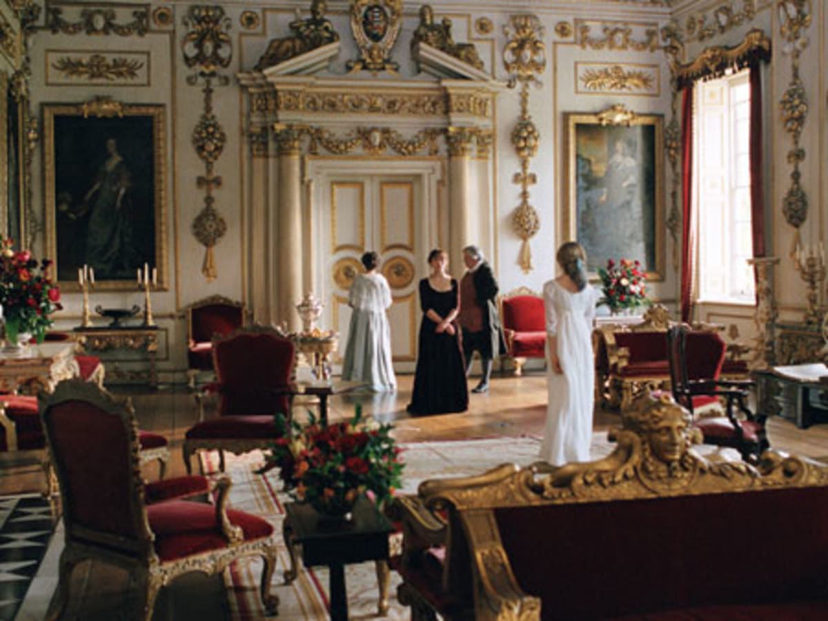 Pride and Prejudice (2005) – Regency-era scene with actors in ornate gold drawing room at Wilton House filming location