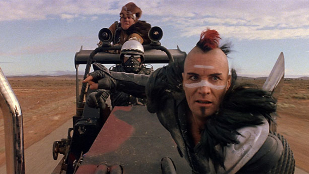 Mad Max 2: The Road Warrior (1982) – Wez character with mohawk in the Australian outback desert filming location
